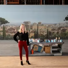 Lynne Coakley, president of JC Backings, with the “Ben-Hur” (1959) movie backdrop in the Scenic Art building at Sony Pictures Studios in Culver City. (Gary Coronado / Los Angeles Times)